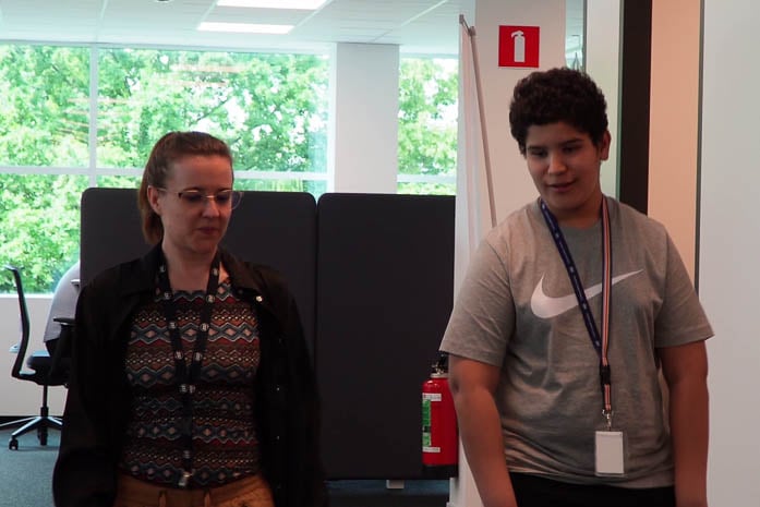 Mentor and young mentee chatting and walking at ISS HQ in Belgium